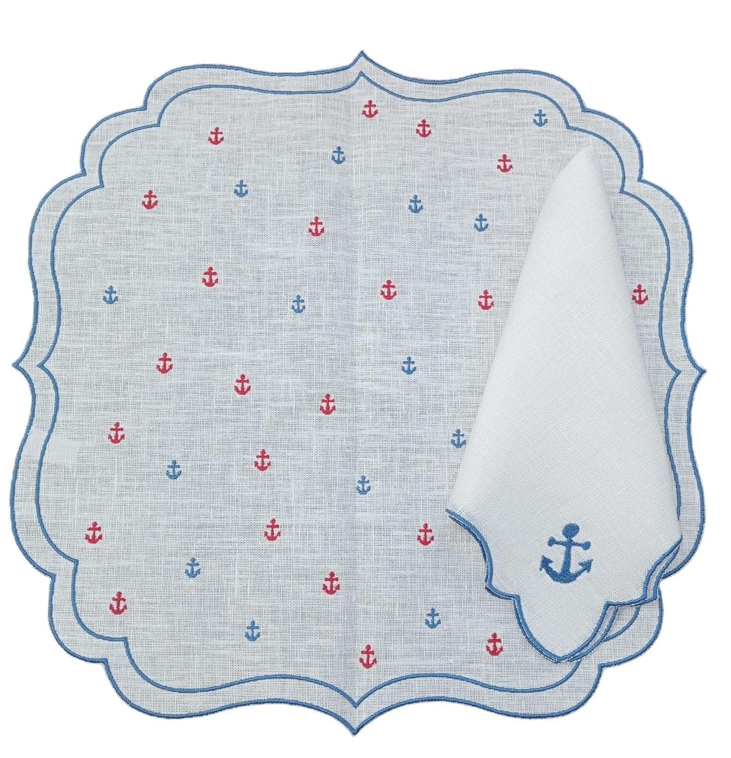 Americano in lino cerato con ricamo ancore blu e rosse e tovagliolo piegato con ricamo blu