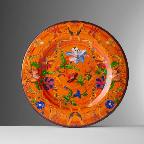 Piatto frutta Pancale arancio di Mario Luca Giusti in melamina, con disegno floreale multicolore e fondo arancio smaltato