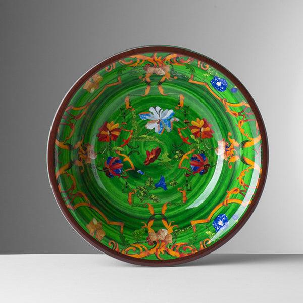Piatto fondo Pancale verde di Mario Luca Giusti in melamina, con decoro floreale vivace e bordo ornamentale giallo e rosso