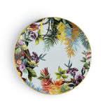 Piatto piano Exotic Jungle Sky di Simone Guidarelli in porcellana azzurro cielo con dettagli botanici tropicali.
