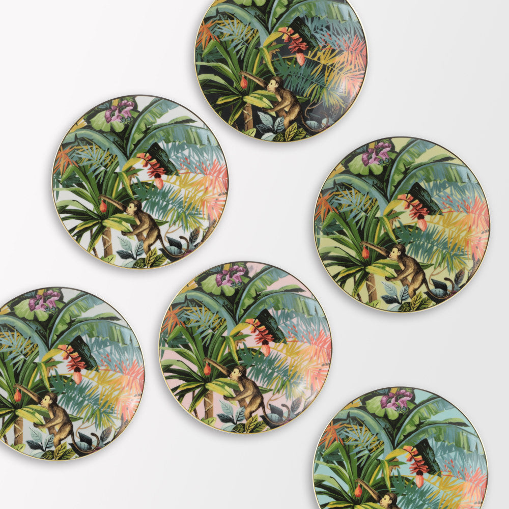 Collezione di piatti frutta Exotic Jungle di Simone Guidarelli in diverse varianti colore con decorazioni tropicali.