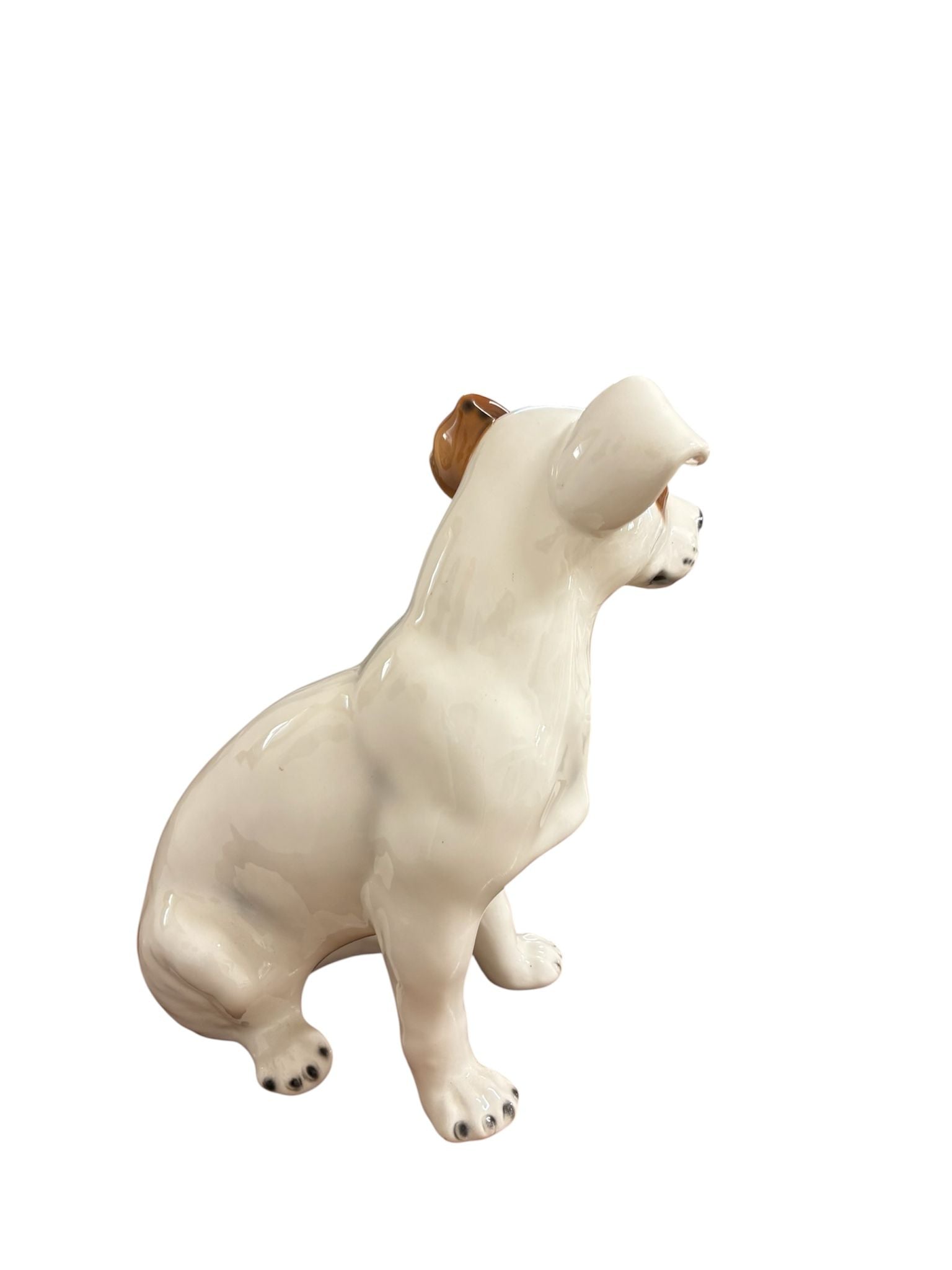 Il retro del Jack Russell in ceramica mostra la cura nei volumi e nelle linee: ogni angolazione conferma l’attenzione dei maestri ceramisti per i dettagli, rendendolo perfetto anche come oggetto da centro stanza o mensola.