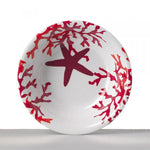 Piatto fondo rosso in melamina Mario Luca Giusti con decoro corallo e stella marina