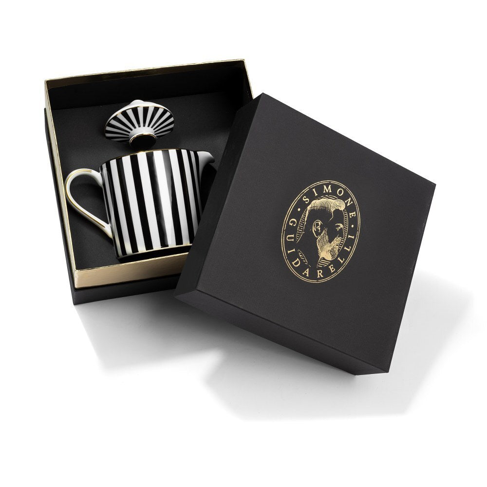 Teiera Souvenirs de Voyage Simone Guidarelli in porcellana bianca e nera con righe verticali e dettagli in vero oro, presentata in elegante scatola regalo nera e oro.